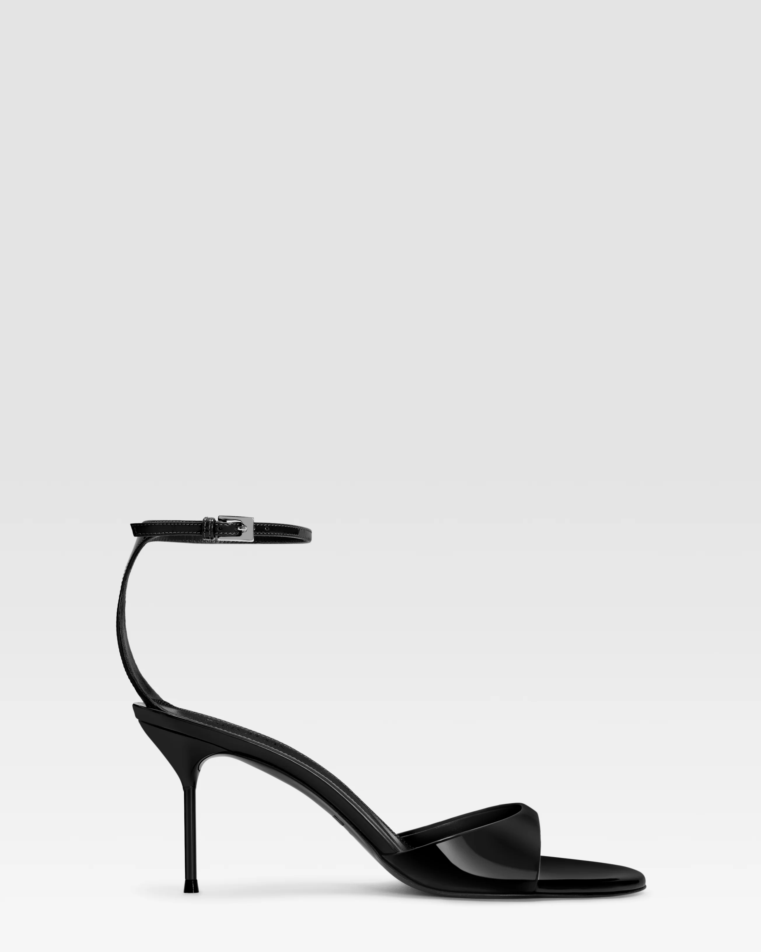 Ankle-strap sandals in black patent leather